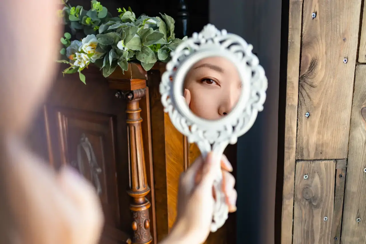 Beautiful young asian woman looks at herself in th 2025 03 13 00 22 25 utc